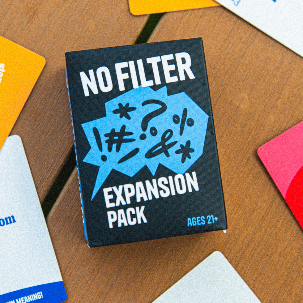 No Filter expansion pack box surrounded by Youphemism cards on a table