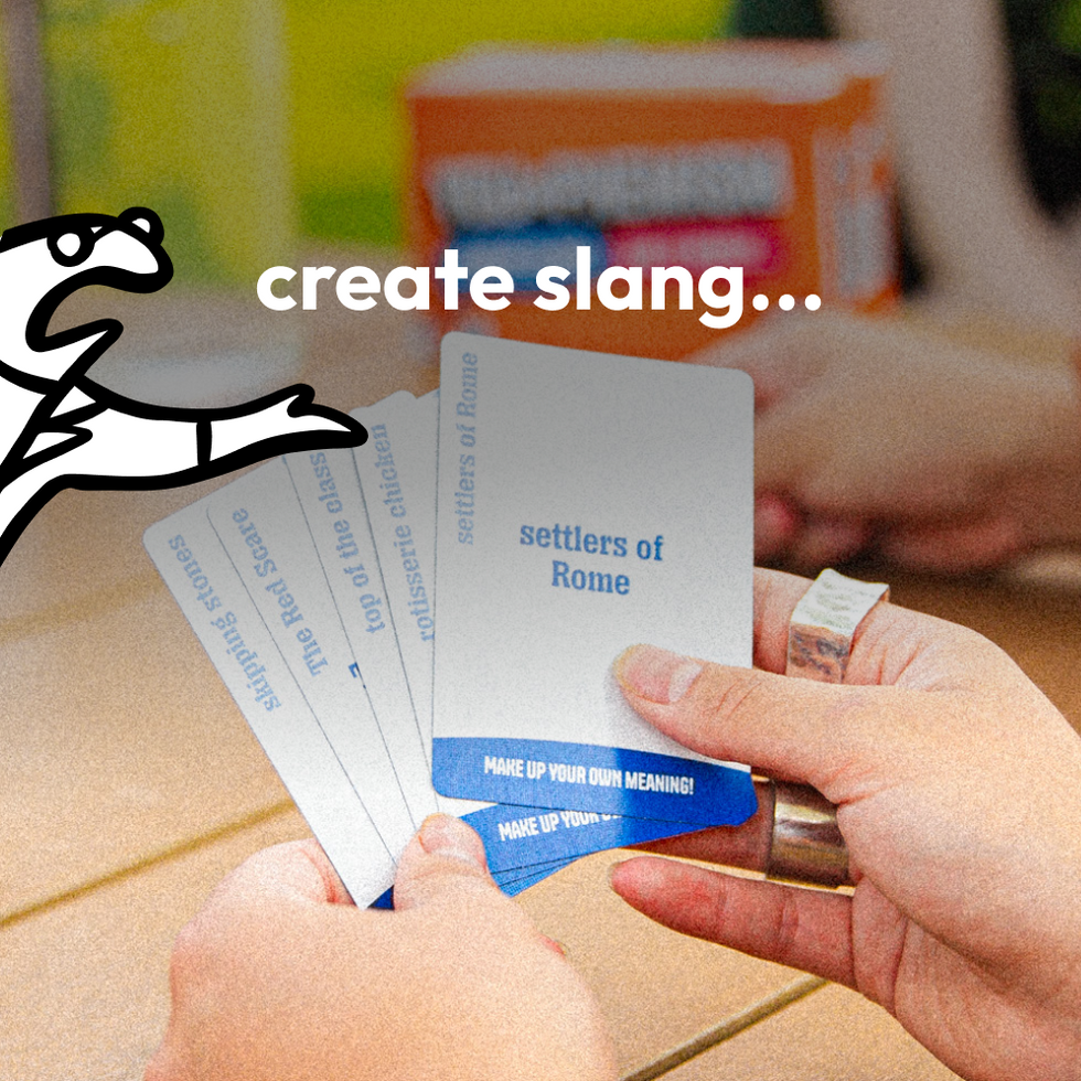Player holding blue You-phemism cards with a create slang prompt