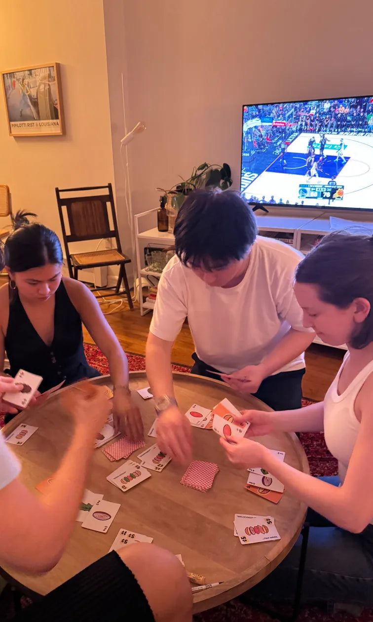 Friends playing Speed Burger around a table